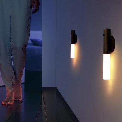 Compact motion-activated LED night light used as a desk lamp, providing soft illumination.